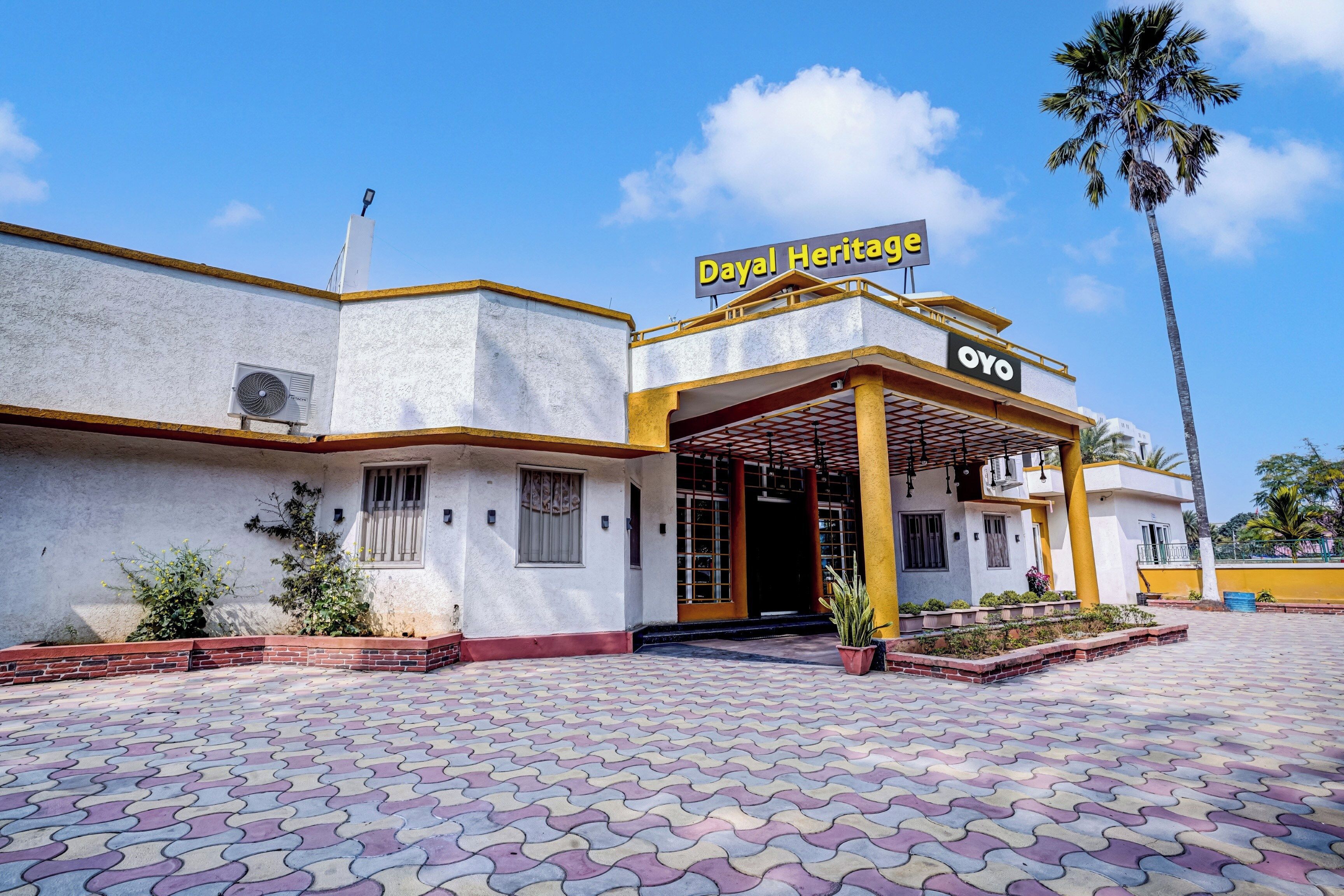 A building with a sign reading 'Dayal Heritage' and 'OYO' on the facade.