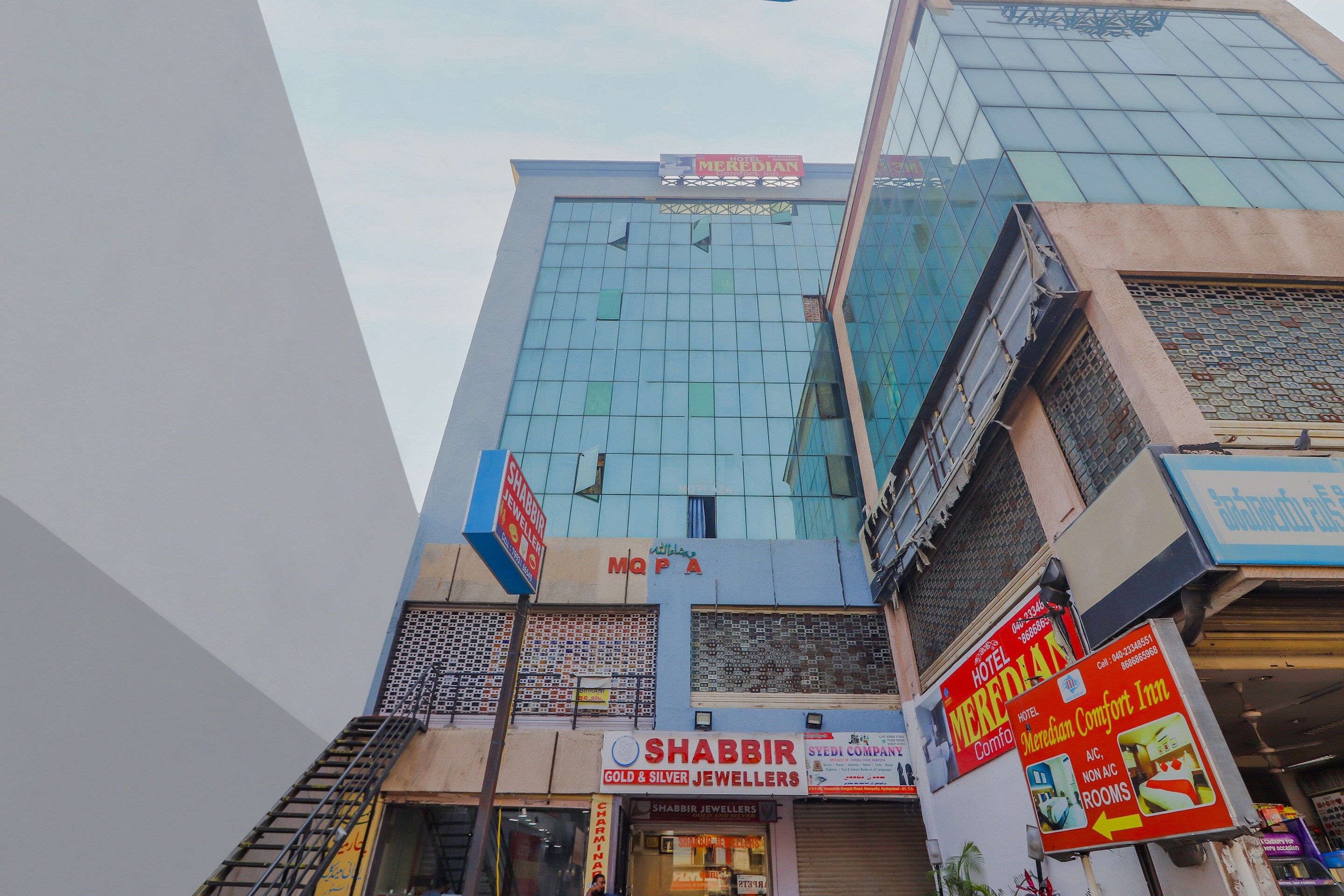 A multi-story building with a modern glass facade.