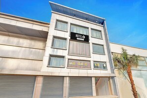 A hotel building with a sign that reads 'HOTEL' and 'Company Serviced.' - Hotel O Kanode Gate (Rewari)