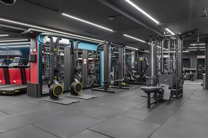 A modern gym with various weightlifting equipment, treadmills, and cardio machines. - Mercury Suites Prestige Stay, Pool Access (St. Julian's)