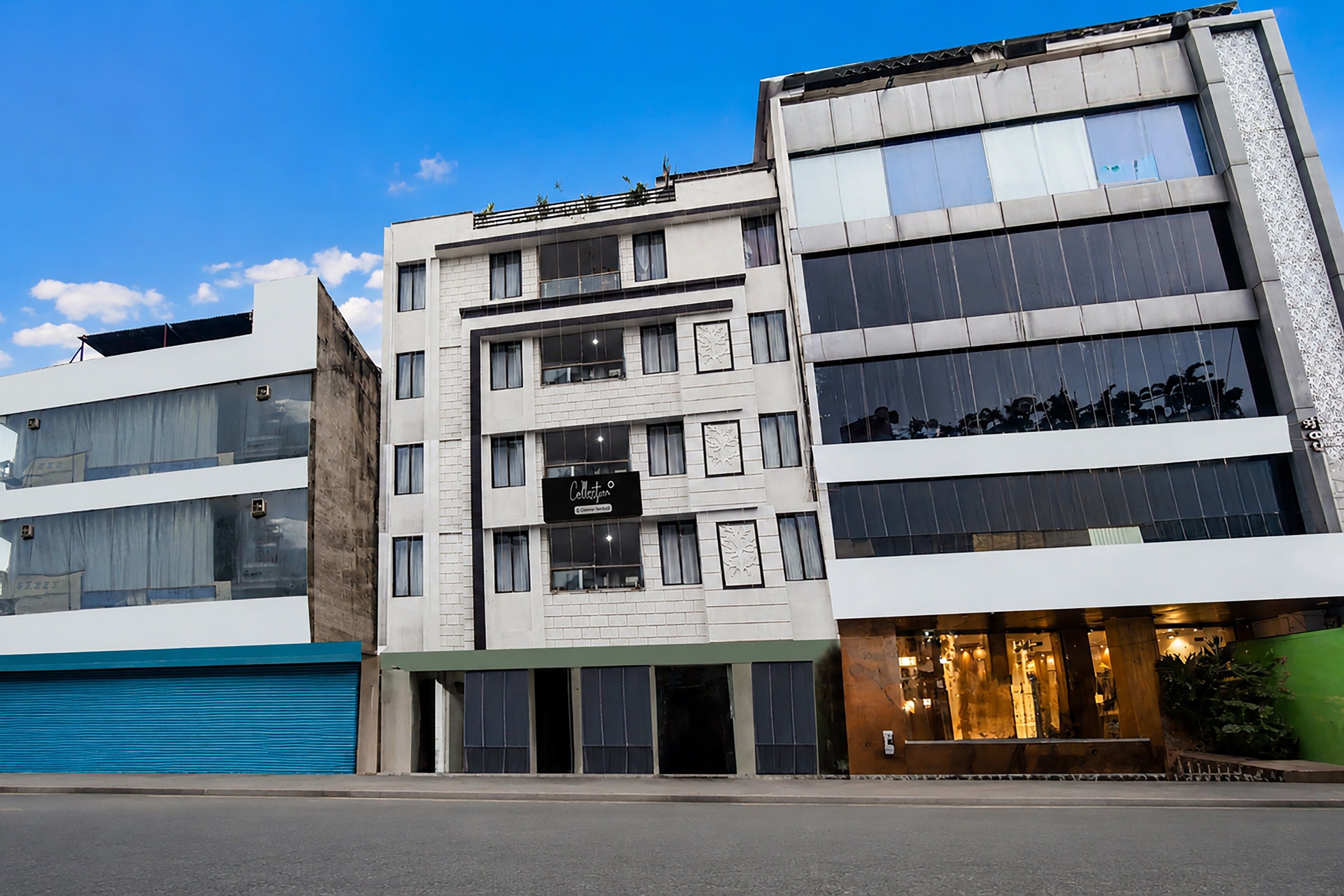 A multi-story building with a modern architectural design, featuring large windows and a flat facade.