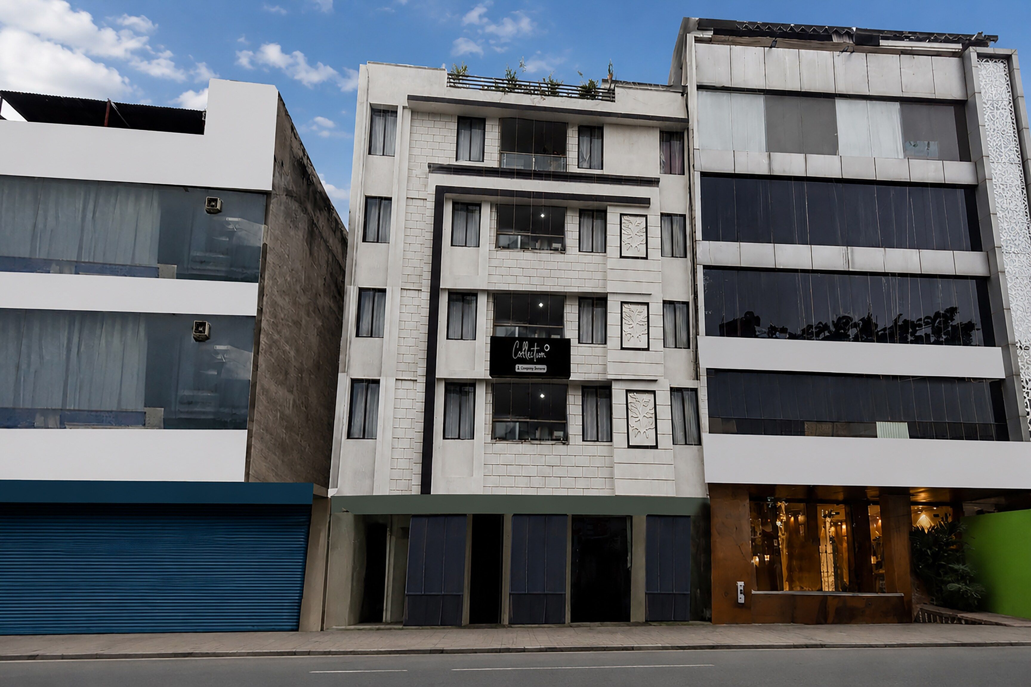 A multi-story building with a storefront on the ground floor.