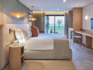 A modern hotel room with a large bed, a desk, and a balcony with a view. - Casa Luma (Cape Town)