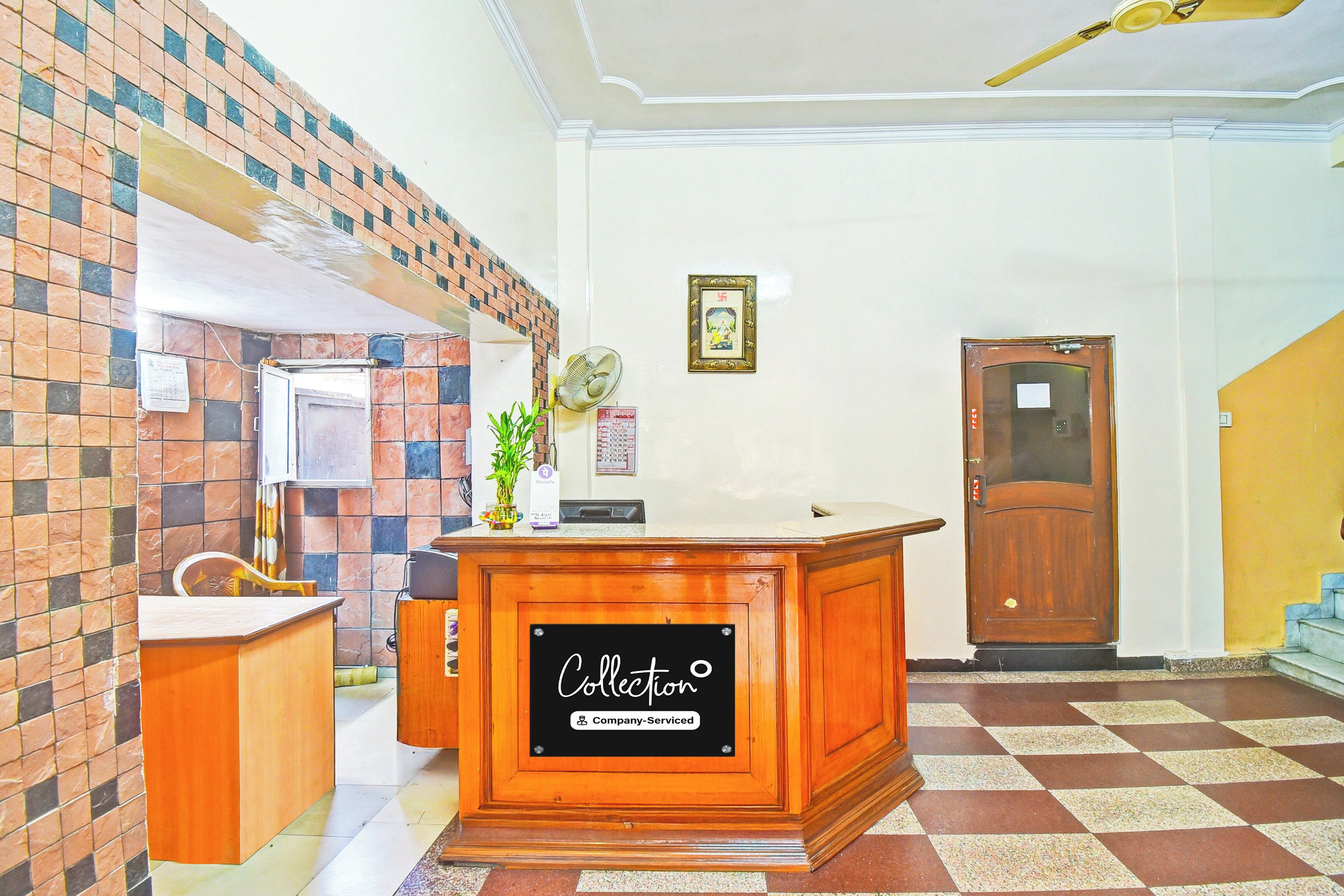 A reception desk with a sign reading 'Collection Company-Serviced'.
