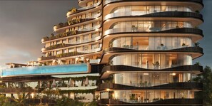 A multi-story hotel with balconies, a pool, and lush greenery. - Aspire, Waterfall City (Midrand)