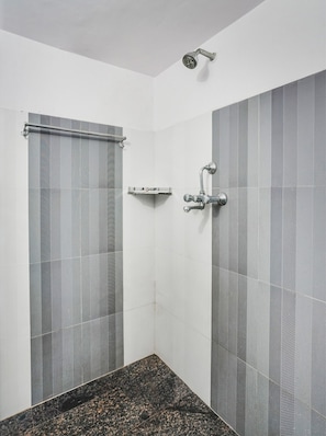 A bathroom with a shower, a towel rack, and a sink. - Hotel O Radhaswami Nagar (Jaipur)