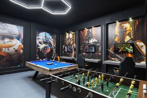 A room with a foosball table, Star Wars posters, and a pool table. - Near Disney/Theater & Game Rooms/Private SPA 25140 (Kissimmee)