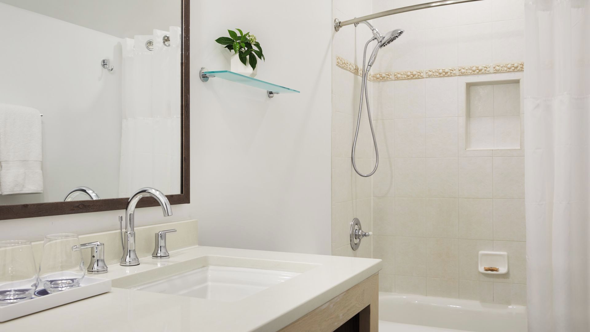 Relax with a soothing shower and crisp, spa-like bathroom finishes.