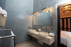 A bathroom with a double sink, a large mirror, and a towel rack. - Dar Al Qamar (Marrakech)