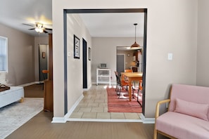 A modern interior with a dining area, a kitchen, and a living space. - Lafayette House | Classic Charm & Beach Minutes Away (Michigan City)