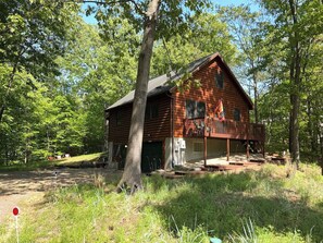 A wooden cabin with a porch, surrounded by trees. - Mt. Baldy Cabin | Game Room, Fire Pit & The Dunes (Michigan City)