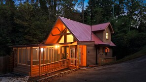 A cabin with a large porch, a separate entrance, and a visible number '721' on the door. - Smokies Sunrise | Cozy Rustic Cabin Experience (Sevierville)