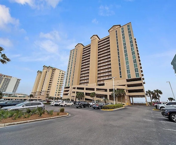 A multi-story parking garage with a clear sky. - Beachfront Corner Condo | 3BR/3BA | Beach Gear | 2 Parking Passes (Gulf Shores)