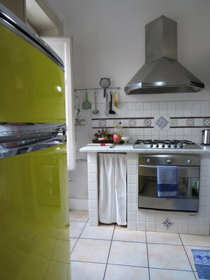A kitchen with a stove, oven, and various kitchen utensils. - New Listing (Palermo)
