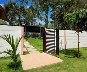 A gated entrance to a property with a sign reading 'HOTEL'. - Classic Kaveri Homestay (Shrirangapattana)