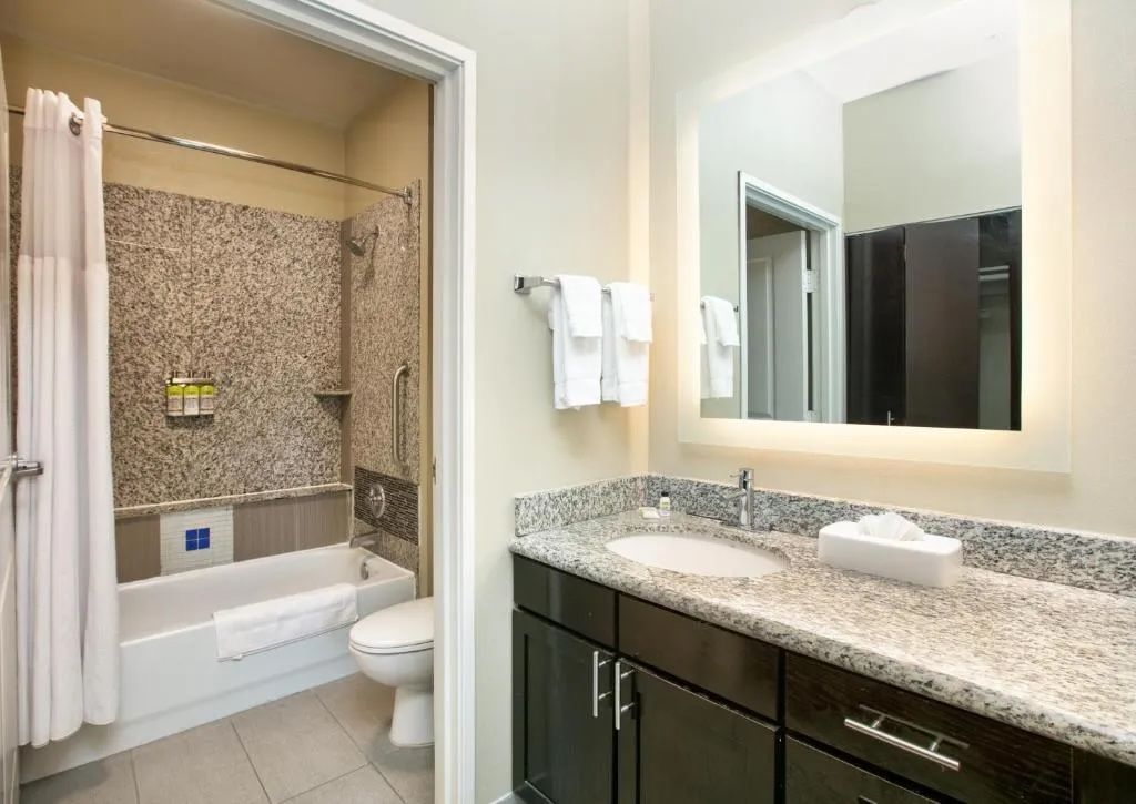 Bathroom with a vanity and sink for getting ready