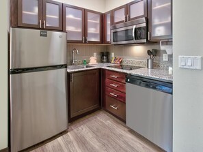 Kitchen with stainless steel appliances and counter space for cooking in - Accessible 1BR Suite | Free Daily Breakfast + Pool (Plano)