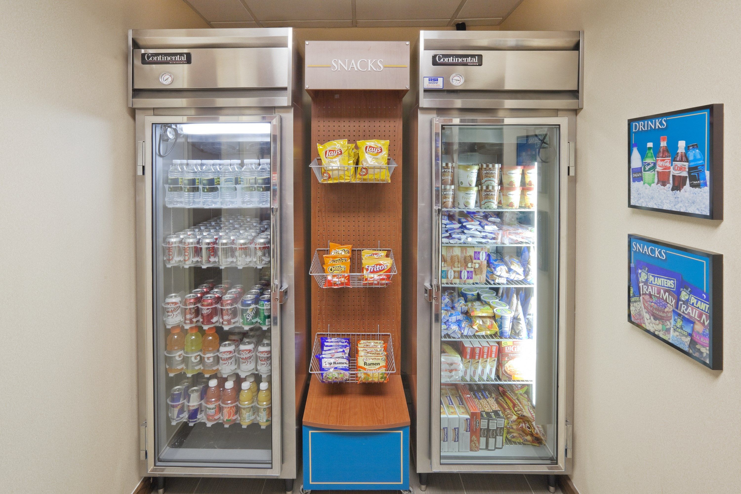A snack and drink vending machine area with snacks and beverages.