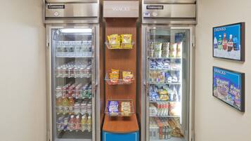 A snack and drink vending machine area with snacks and beverages.