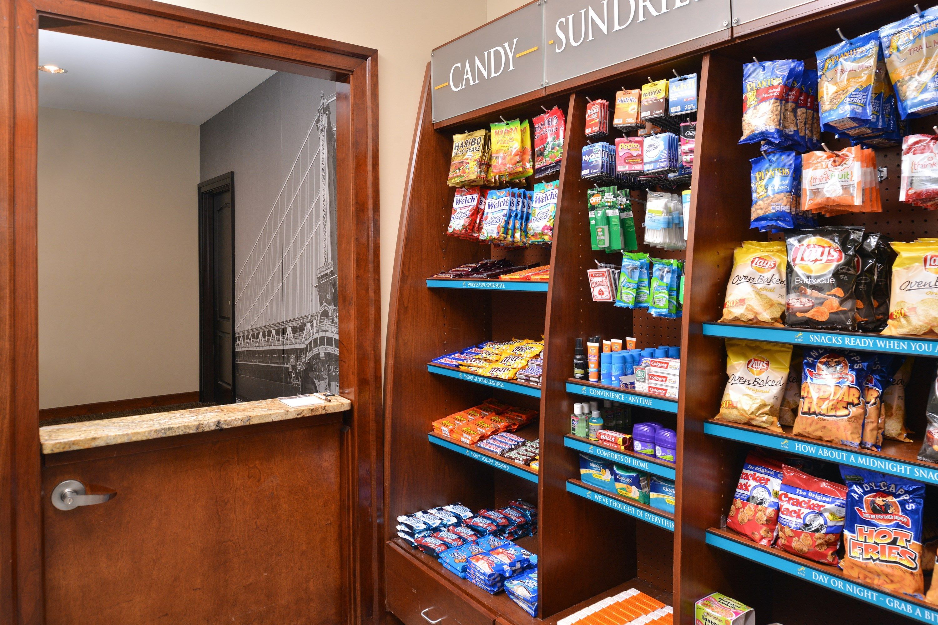 A candy and sundries display with various snacks and beverages.