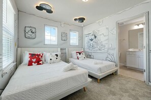A hotel room with two beds, a bathroom, and a kitchenette. - Windsor Cay 5BR Pool, Themed Rooms, Lazy River (Clermont)