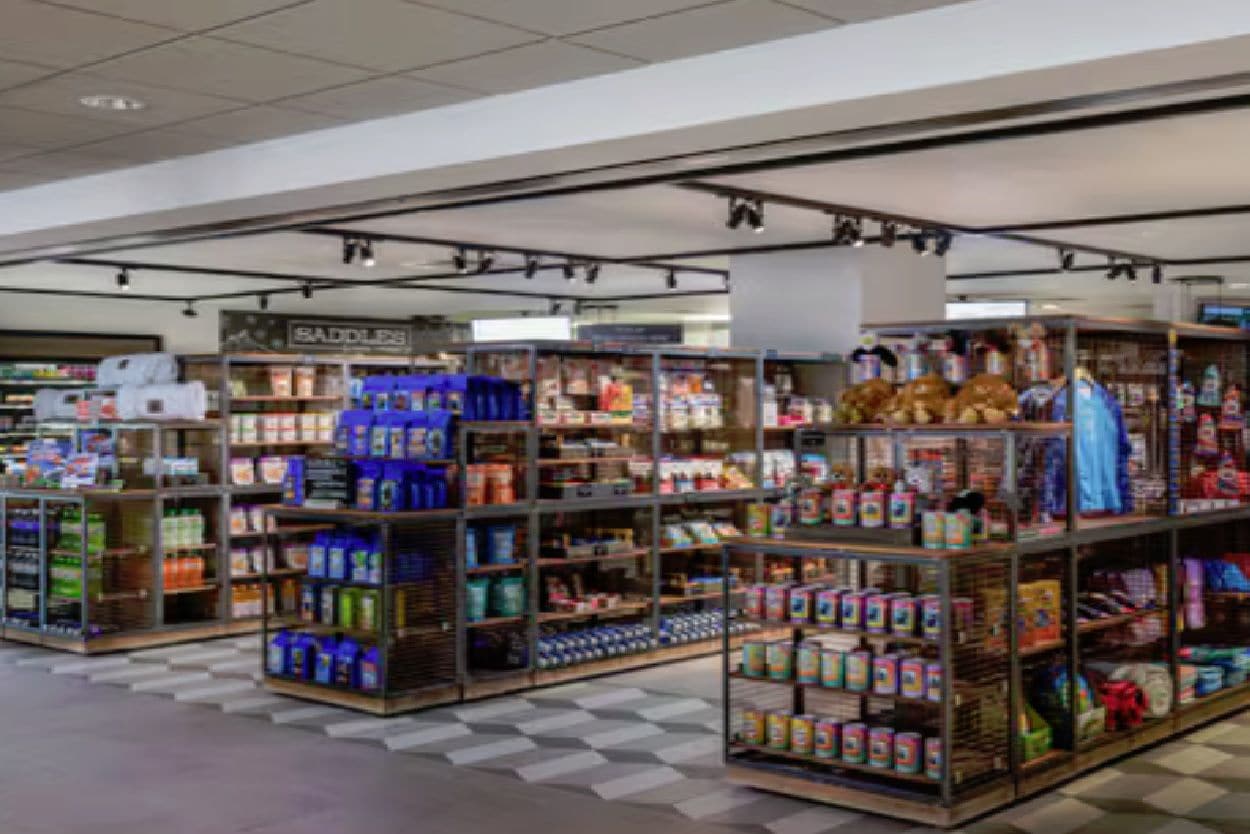 A retail store with shelves stocked with various products, including personal care items and toys.