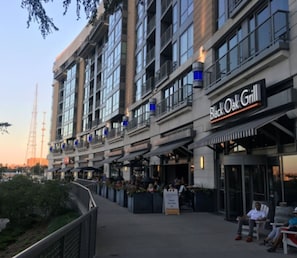 A multi-story building with a restaurant named 'Black Oak Grill' on the ground floor. - Prime Location Midtown Omaha (Omaha)