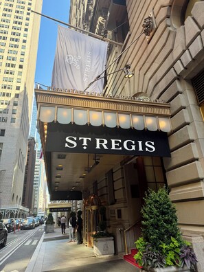 A theater marquee with the name 'ST REGIS' and a classical architectural facade. - Timeless 1 Bedroom Suite Luxury at The Iconic St. Regis New York (New York)