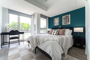 A bedroom with a bed, a desk, and a chair. - Skip Downtown Traffic! Pristine 3BR, steps to Yorkdale/TTC (Toronto)