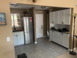 A kitchen with a refrigerator, cabinets, and a countertop. - Skye Villa is now available! Spacious  2 bedroom  in enchanting Fairfield Bay (Fairfield Bay)