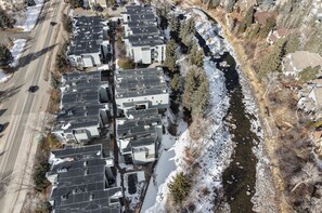 A residential area with multiple houses, a river, and a road. - Ski condo on Eagle River,  Close to BC & Vail (Avon)