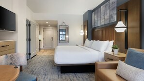 A hotel room with a bed, bedside tables, a TV, a chair, and a desk. - Heavenly! South Lake Tahoe for Thanksgiving weekend and beyond. (South Lake Tahoe)