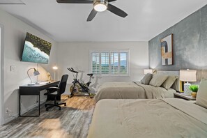 A bedroom with a desk, bicycle, and two beds. - Entire Private Home with 6 Beds, King Bed, 6 Parking, Big Yard, Available Now (Spring Valley)