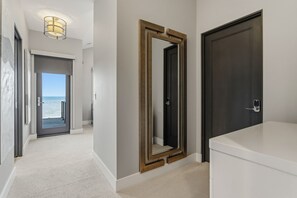 Lake views greet you along the upstairs hallway - Michigan Shores | Beachfront • Heated Private Pool (South Haven)