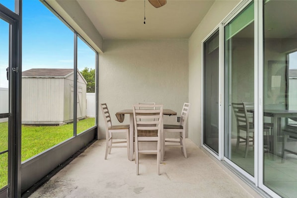 Gather for meals or enjoy a quiet moment in the enclosed patio space - Sunshine & Stay Awhile (Davenport)
