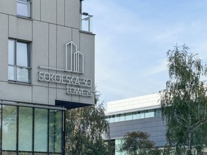 A building with a sign that reads 'SOKOŁSKA TOWERS' and a modern architectural design. - Sokolska Towers Studio 92 (Katowice)