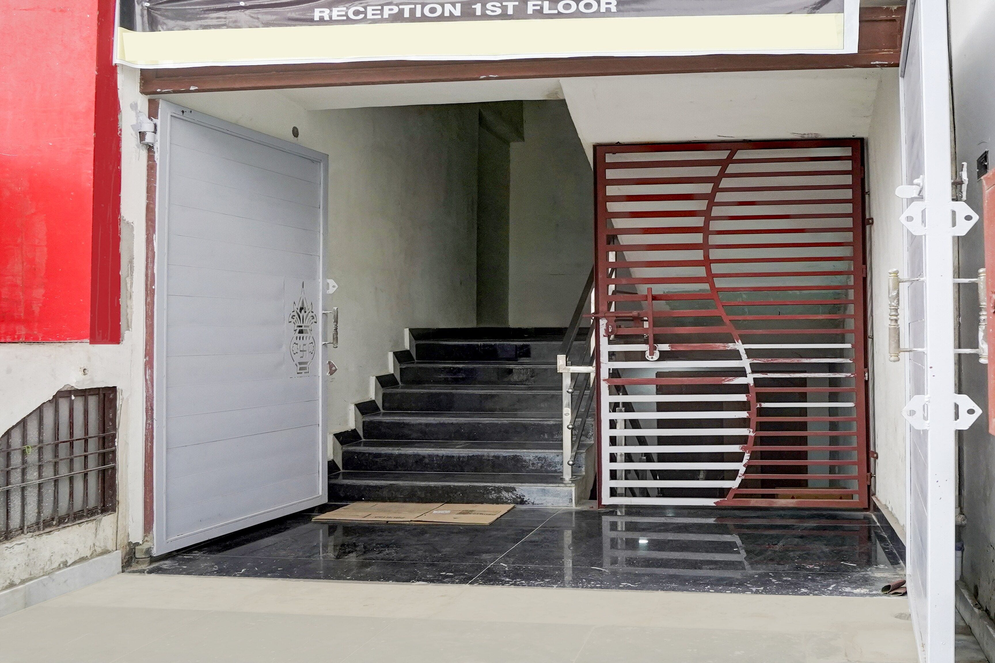 A staircase leading to the reception area on the first floor of a building.