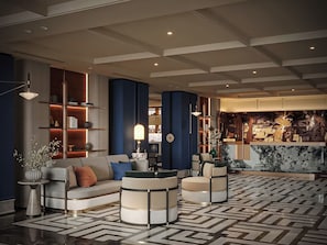 A modern lobby with a sofa, armchairs, a coffee table, and a patterned floor. - Hôtel Étoilée Hanoï (Cau Giay)