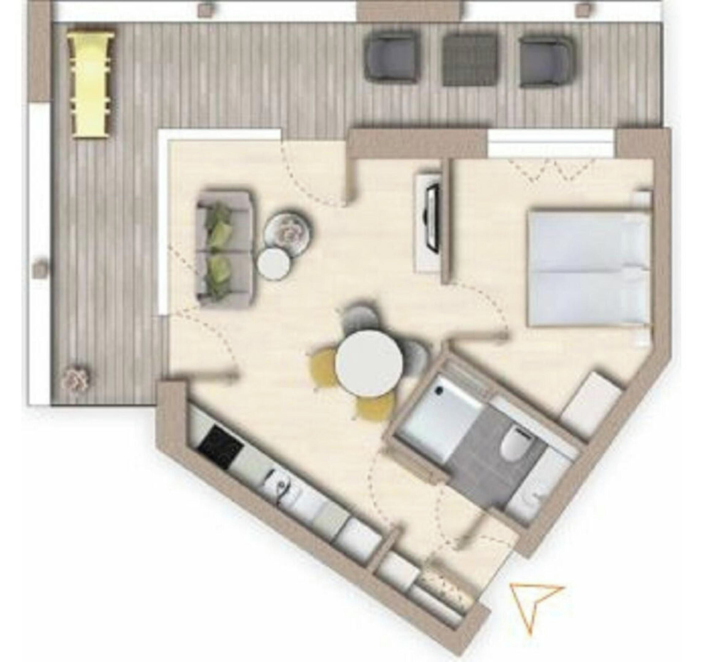 A hotel room layout with a bed, bathroom, kitchenette, and seating area.