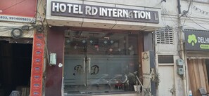 A hotel entrance with a large sign reading 'HOTEL RD INTERNATIONAL'. - Hotel O R D International (Amritsar)