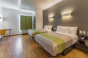 A hotel room with two beds, a desk, and a chair. - 2 Queen Beds|NS| Kitchen (New Braunfels)