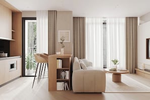A modern living room with a sofa, a coffee table, a bookshelf, and a dining area with chairs. - FUKURAI PREMIUM APARTMENTS  (Giang Vo)