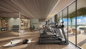A modern gym with treadmills, weights, and a yoga mat. - Executive Suite | Brand New | Resort Pool + Gym | Near Beach | Nexo Miami (North Miami Beach)