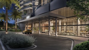 A modern hotel entrance with a car parked in front, a covered outdoor seating area, and a building with a 'NEYO' sign. - High Floor Signature Suite | Brand New | Resort Pool + Gym | Nexo Miami (North Miami Beach)