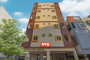 A multi-story building with a sign for 'OYO Rooms' and 'Anitha Ram Arcade' indicating a hotel or lodging facility. - Hotel O by OYO Walk Inn Hotels (Hyderabad)