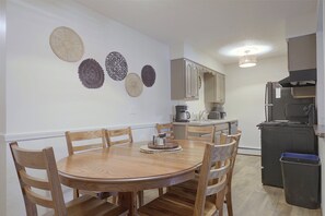Dining & Kitchen Area | 2-Story Condo - Lakefront Escape in Eagle River! Boat, Fish + Play (Eagle River)