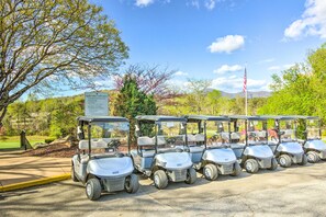 A row of golf carts parked in a parking lot with a sign indicating the Apple Valley Golf Course. - Lake Lure Mtn Getaway w/ Private Balcony (Lake Lure)