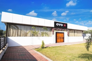 A modern building with a sign reading 'OYO' and 'Godavari Lawn'. - Hotel O Godavari Lawn (Jabalpur)