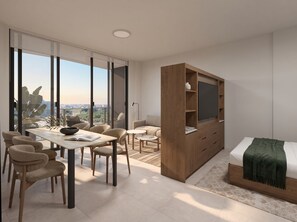 Un dormitorio moderno con un gran ventanal, una cama con manta verde, un mueble de televisión de madera y una zona de comedor con sillas y una mesa.