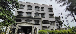A multi-story building with a sign reading 'HIGHWAY INN INTERNATIONAL' at the entrance.